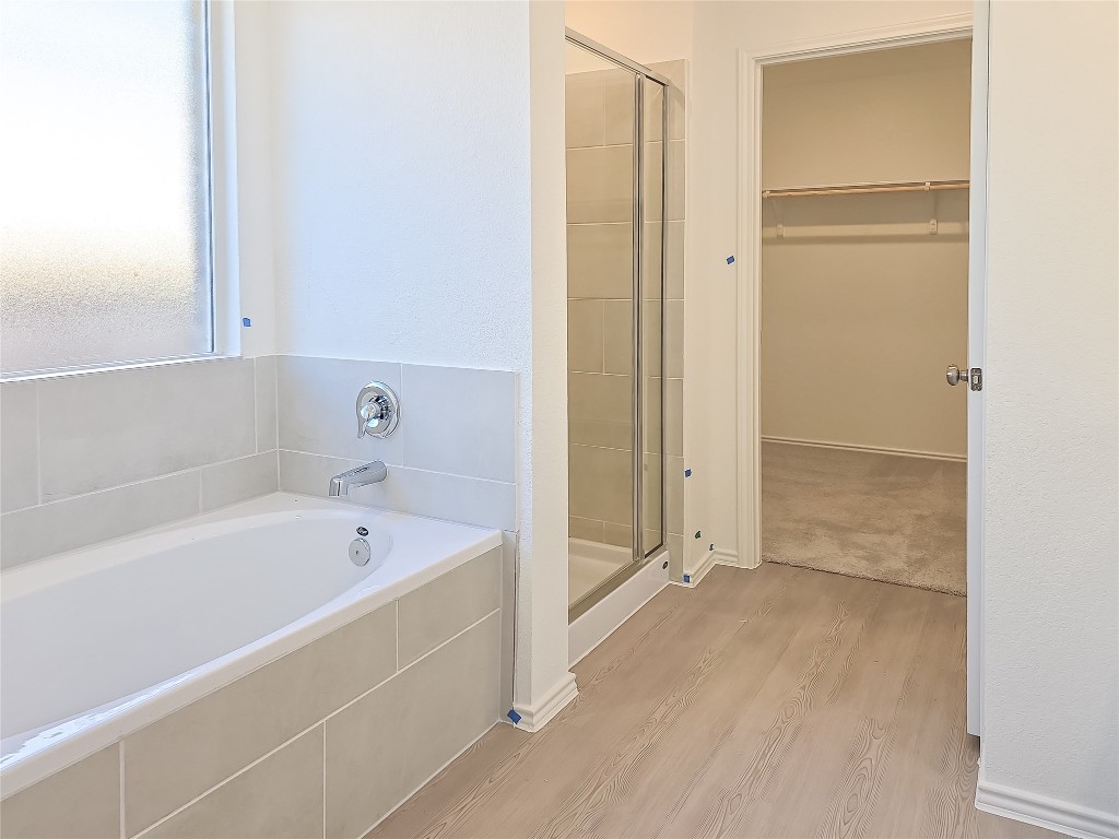 1117 Nesting Bird Drive Georgetown, TX 78628 - Photo 16 of 20 a bathroom with a tub shower and sink