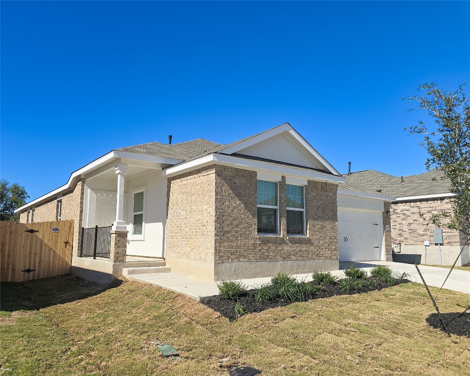 1117 Nesting Bird Drive Georgetown, TX 78628 - Photo 2 of 20 a front view of a house with a yard