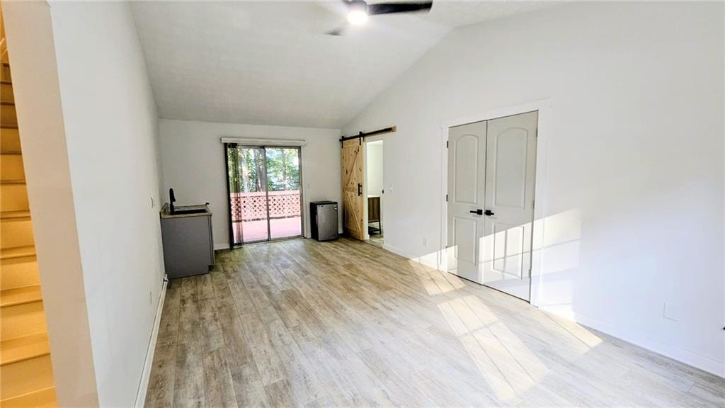 10505 Ash Rill Drive Alpharetta, GA 30022 - Photo 14 of 57 a view of empty room with wooden floor and fan
