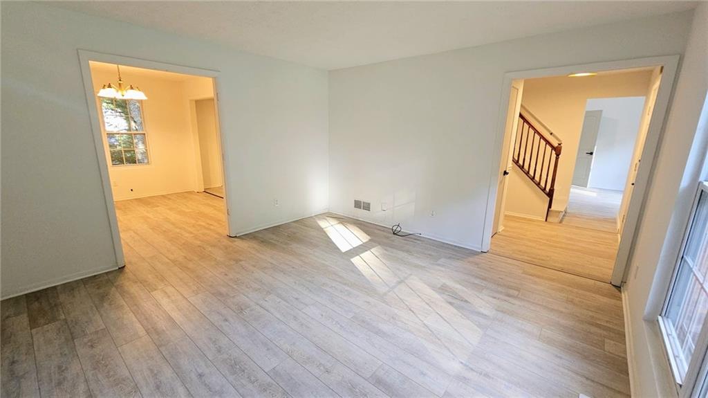 10505 Ash Rill Drive Alpharetta, GA 30022 - Photo 31 of 57 a view of empty room with wooden floor and fan