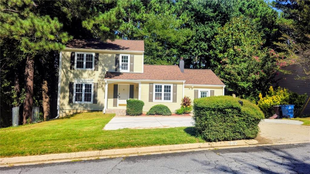 10505 Ash Rill Drive Alpharetta, GA 30022 - Photo 36 of 57 a front view of a house with a yard
