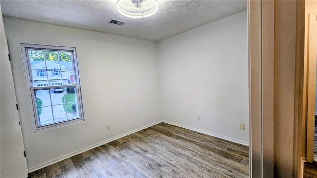 10505 Ash Rill Drive Alpharetta, GA 30022 - Photo 44 of 57 a view of empty room with wooden floor