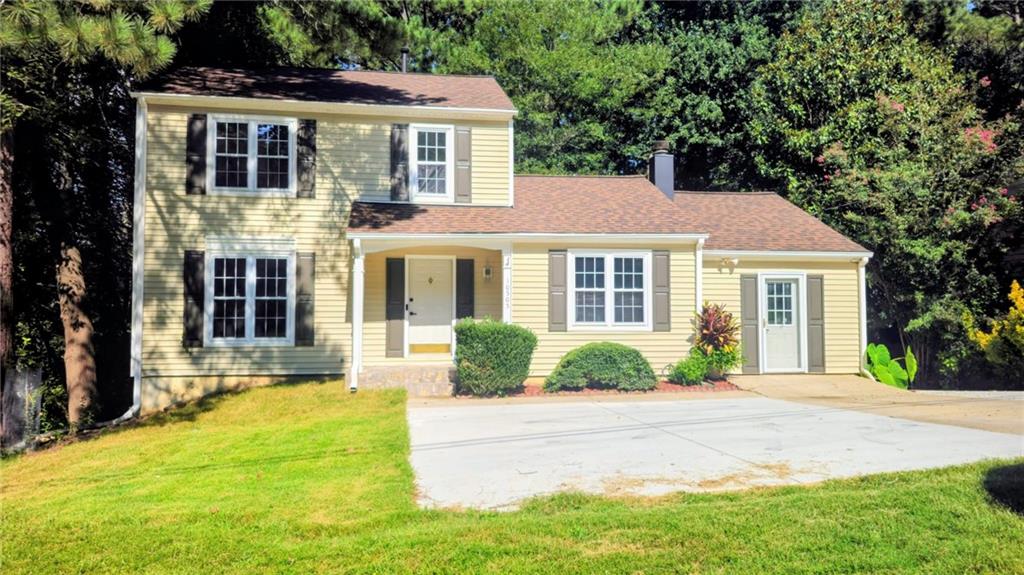 10505 Ash Rill Drive Alpharetta, GA 30022 - Photo 52 of 57 a front view of a house with a yard