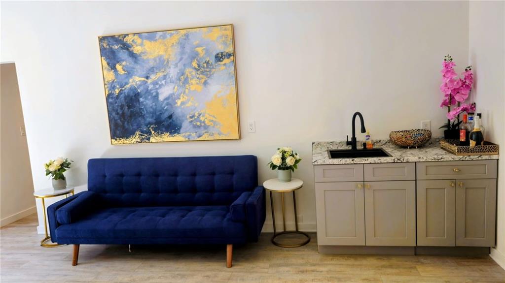 10505 Ash Rill Drive Alpharetta, GA 30022 - Photo 53 of 57 a living room with furniture and a potted plant