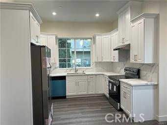 424 Concord Avenue, Unit 2 Monrovia, CA 91016 - Photo 5 of 11 a kitchen with stainless steel appliances granite countertop a stove a sink and a refrigerator