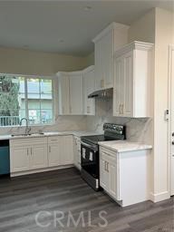 424 Concord Avenue, Unit 2 Monrovia, CA 91016 - Photo 6 of 11 a kitchen with stainless steel appliances granite countertop a stove a sink and white cabinets
