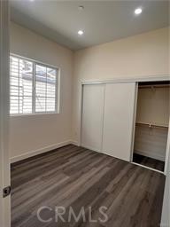 424 Concord Avenue, Unit 2 Monrovia, CA 91016 - Photo 7 of 11 an empty room with wooden floor closet and windows