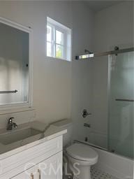424 Concord Avenue, Unit 2 Monrovia, CA 91016 - Photo 10 of 11 a bathroom with a granite countertop sink a toilet and a mirror