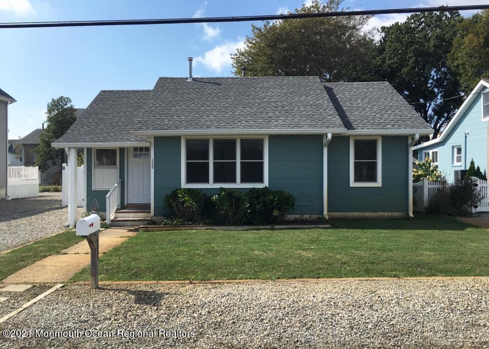 124 Gary Road Toms River, NJ 08753 - Photo 1 of 18 a front view of a house with a yard and porch