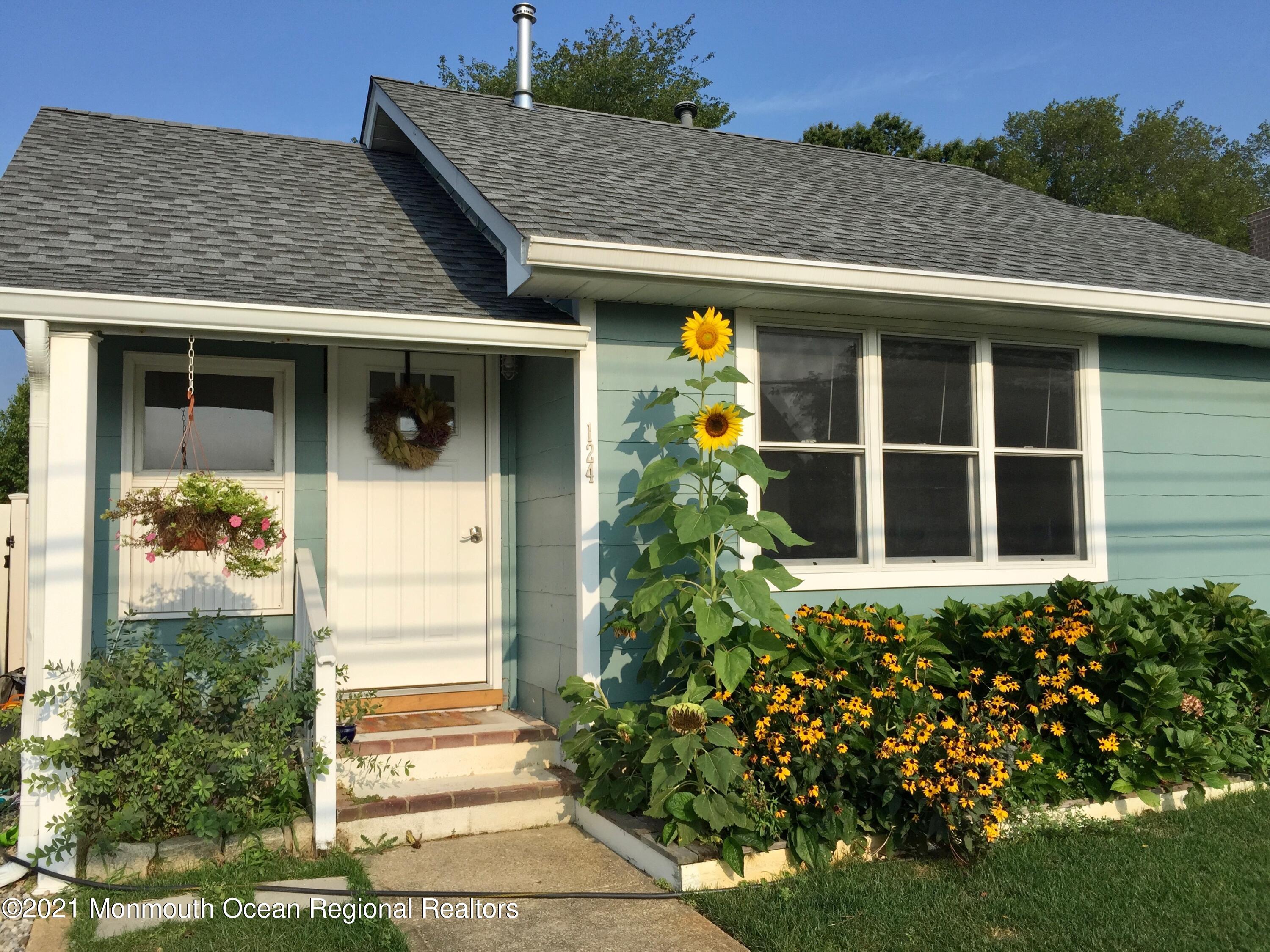 124 Gary Road Toms River, NJ 08753 - Photo 2 of 18 a front view of a house with a yard
