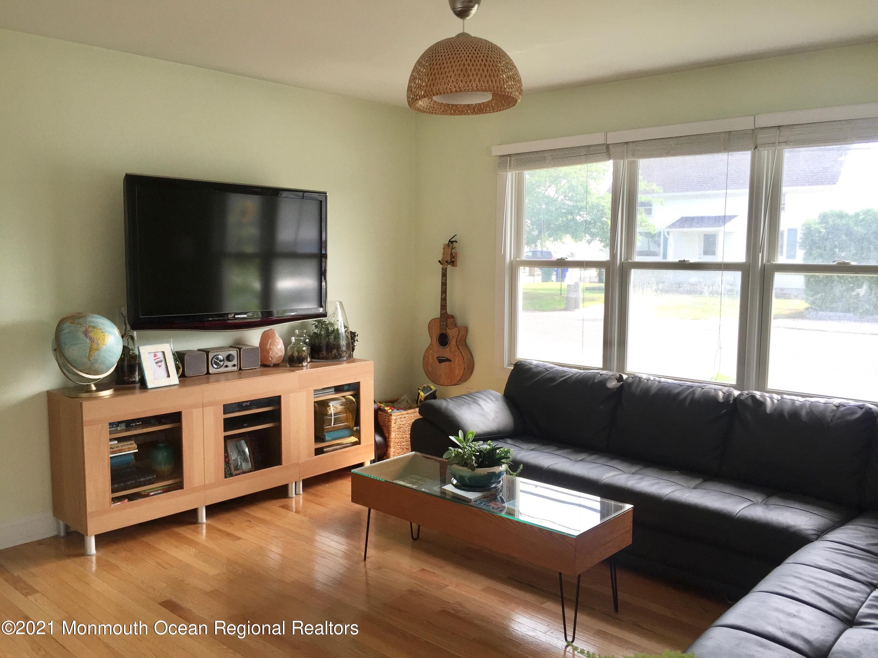 124 Gary Road Toms River, NJ 08753 - Photo 3 of 18 a living room with furniture and a flat screen tv