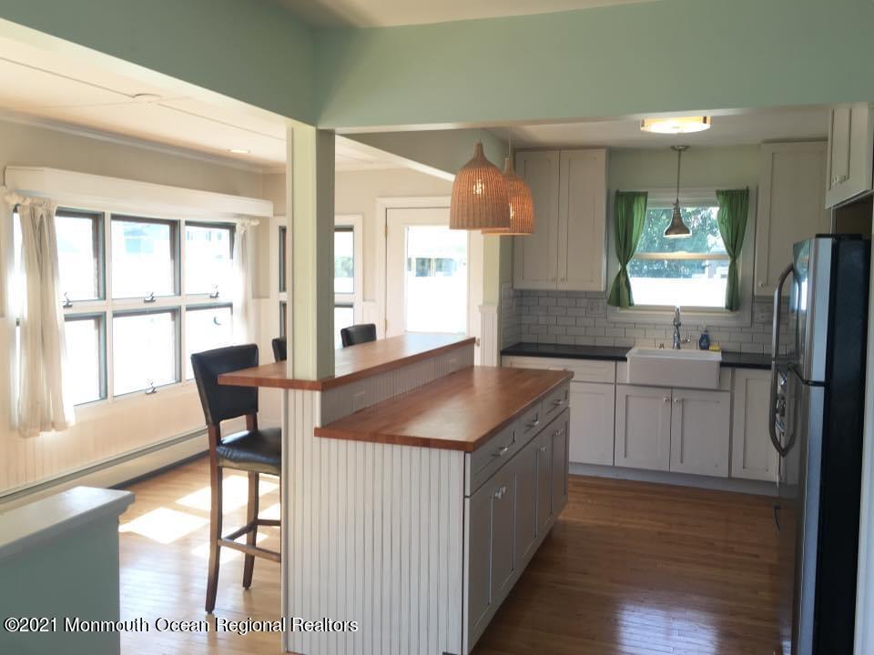 124 Gary Road Toms River, NJ 08753 - Photo 5 of 18 a kitchen with stainless steel appliances granite countertop a sink refrigerator and window