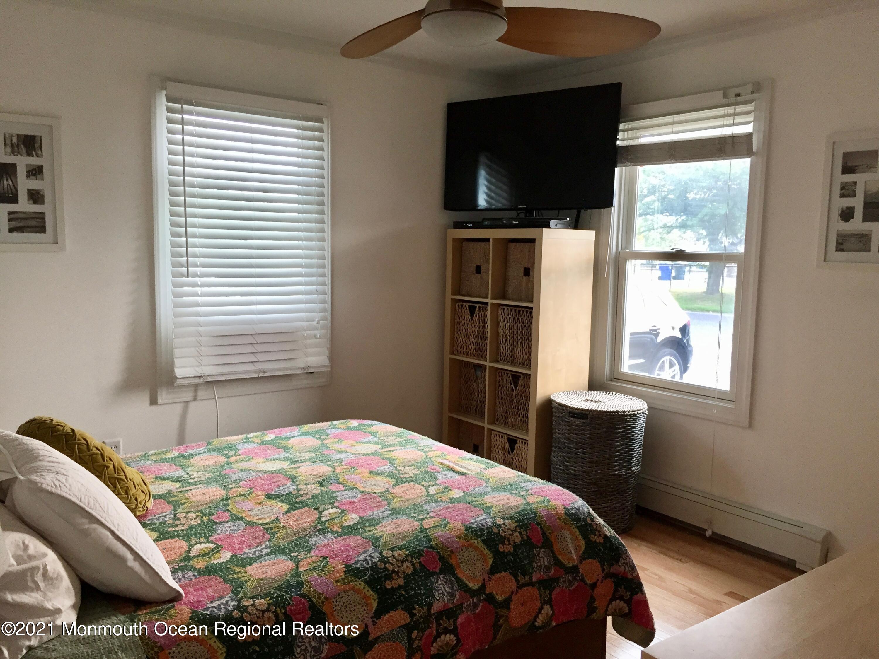 124 Gary Road Toms River, NJ 08753 - Photo 10 of 18 a bedroom with a bed and a flat tv screen