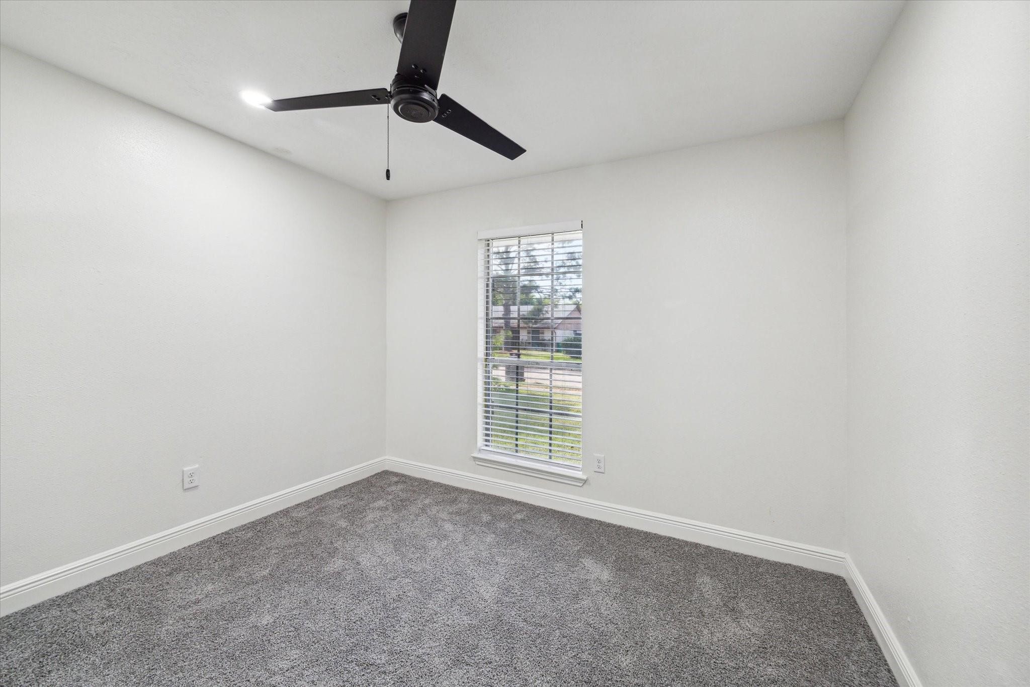 3217 Ripple Creek Circle Baytown, TX 77521 - Photo 6 of 8 a view of an empty room with a window