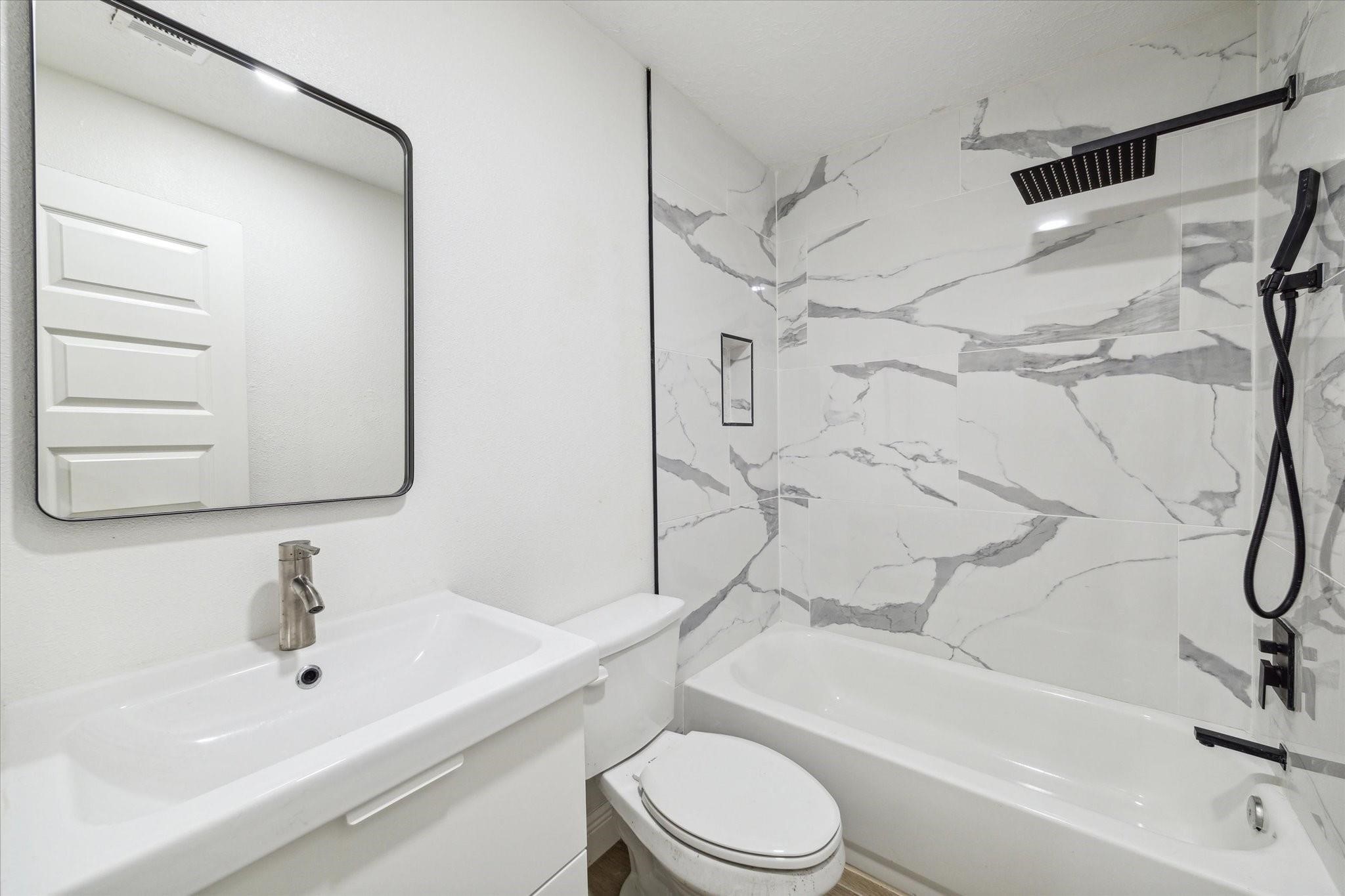 3217 Ripple Creek Circle Baytown, TX 77521 - Photo 7 of 8 a bathroom with a sink toilet and shower