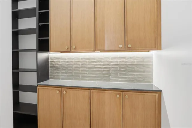 a spacious bedroom with a bed and a window