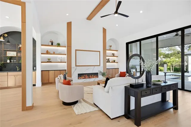 a living room with furniture and a large window