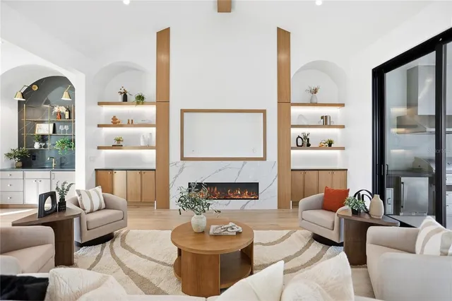 a living room with lots of furniture and a chandelier