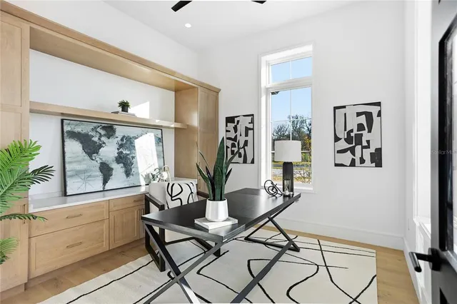 a large bathroom with a double vanity sink a mirror and a bathtub