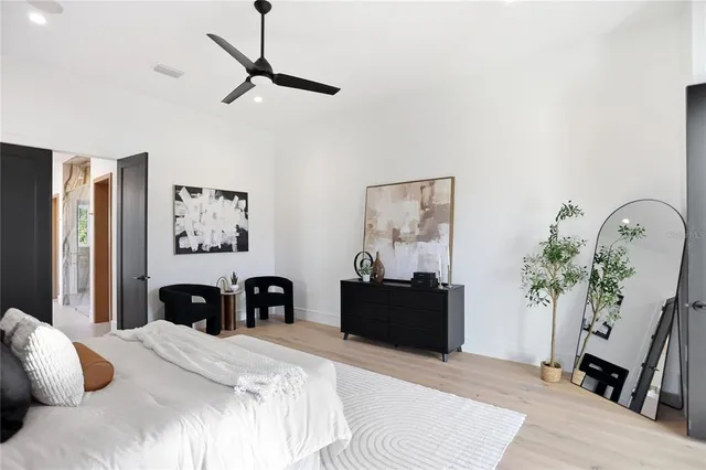 a bathroom with a tub shower and sink