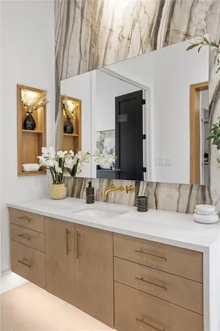 a view of a hallway with wooden floor and entryway