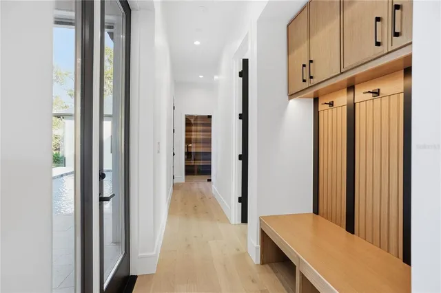 a bathroom with a granite countertop toilet sink and mirror