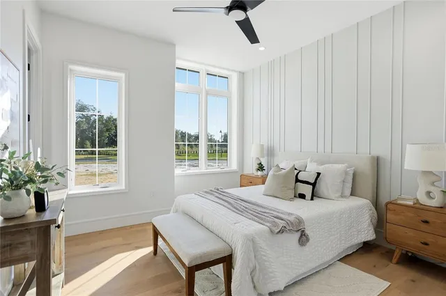 a view of empty room with cabinet and wooden floor