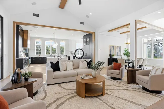a large kitchen with a table and chairs