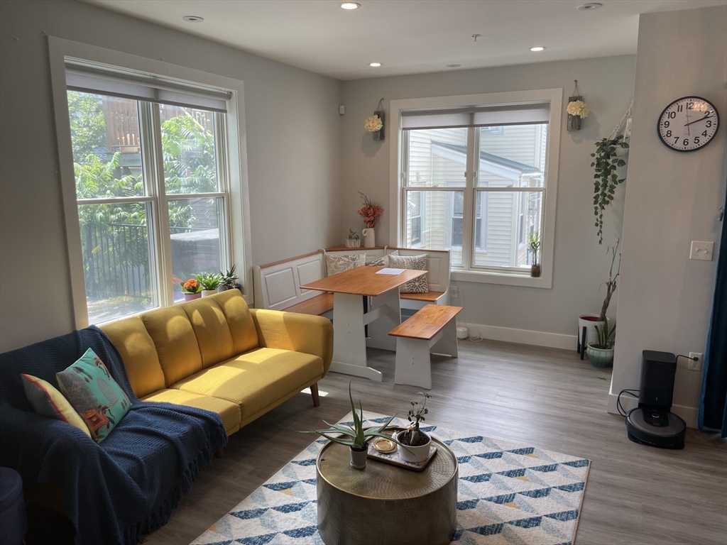 151 Hancock Street, Unit 5 Quincy, MA 02171 - Photo 4 of 12 a living room with furniture and a window