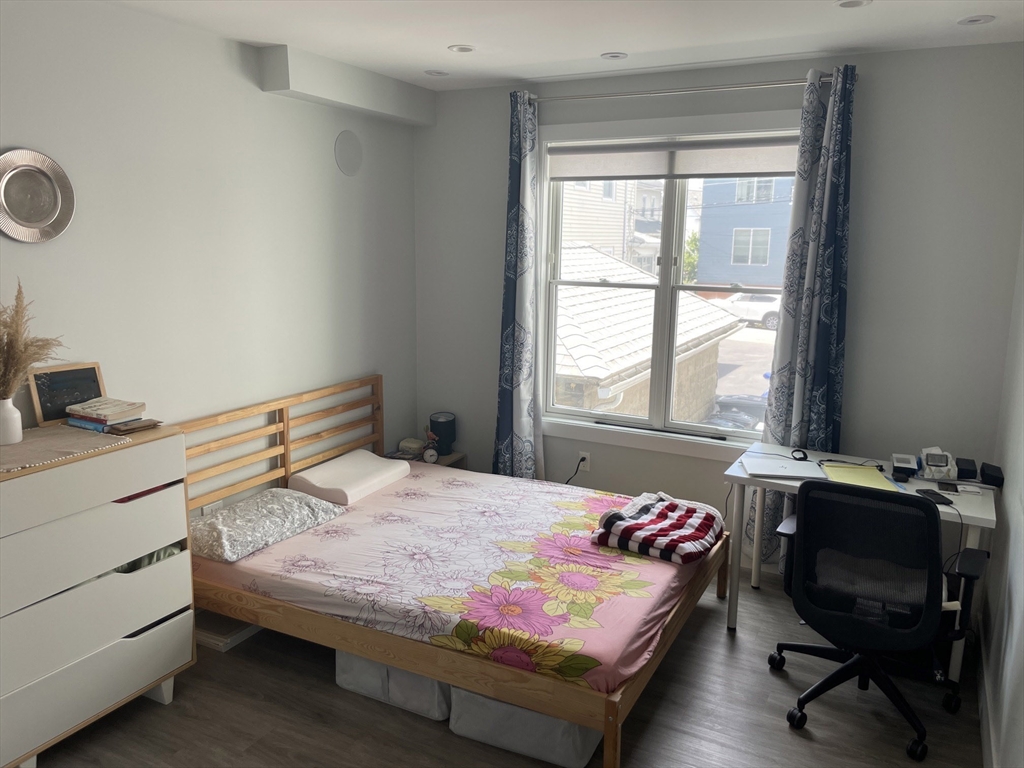 151 Hancock Street, Unit 5 Quincy, MA 02171 - Photo 7 of 12 a bedroom with a bed and a window