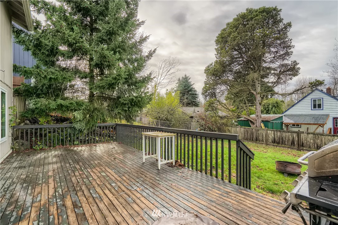 5445 17th Avenue Southwest Seattle, WA 98106 - Photo 17 of 19 a view of balcony with wooden floor and fence