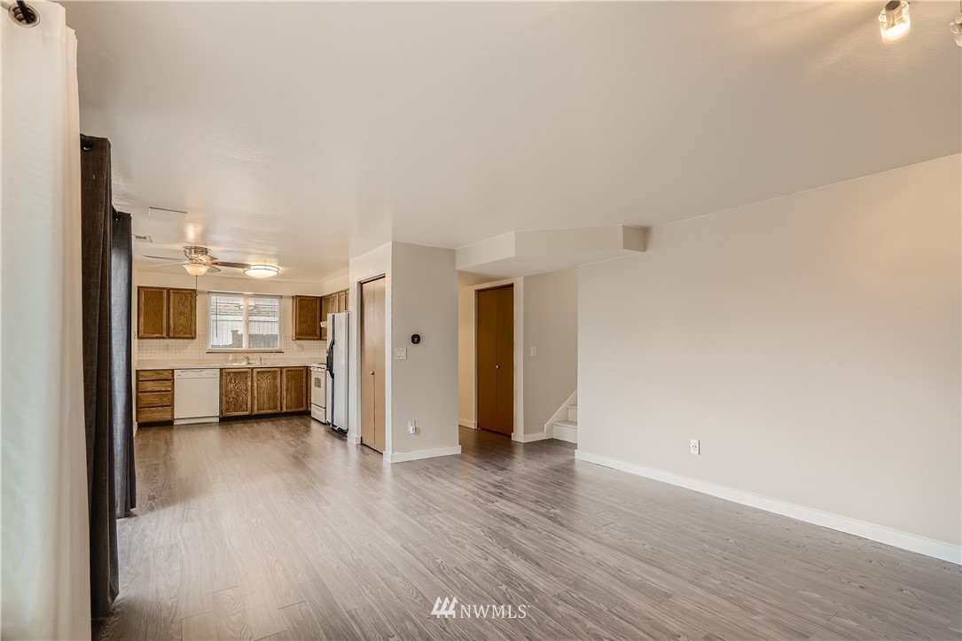 5445 17th Avenue Southwest Seattle, WA 98106 - Photo 6 of 19 a view of a big room with wooden floor and windows