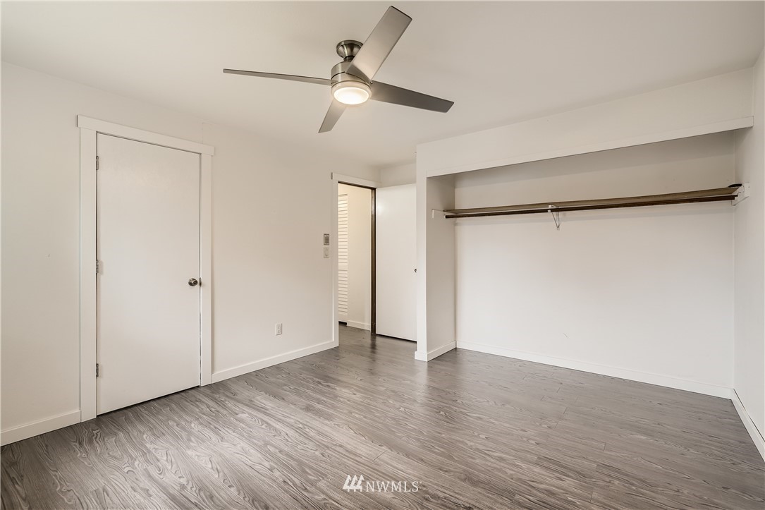 5445 17th Avenue Southwest Seattle, WA 98106 - Photo 9 of 19 a view of an empty room with wooden floor
