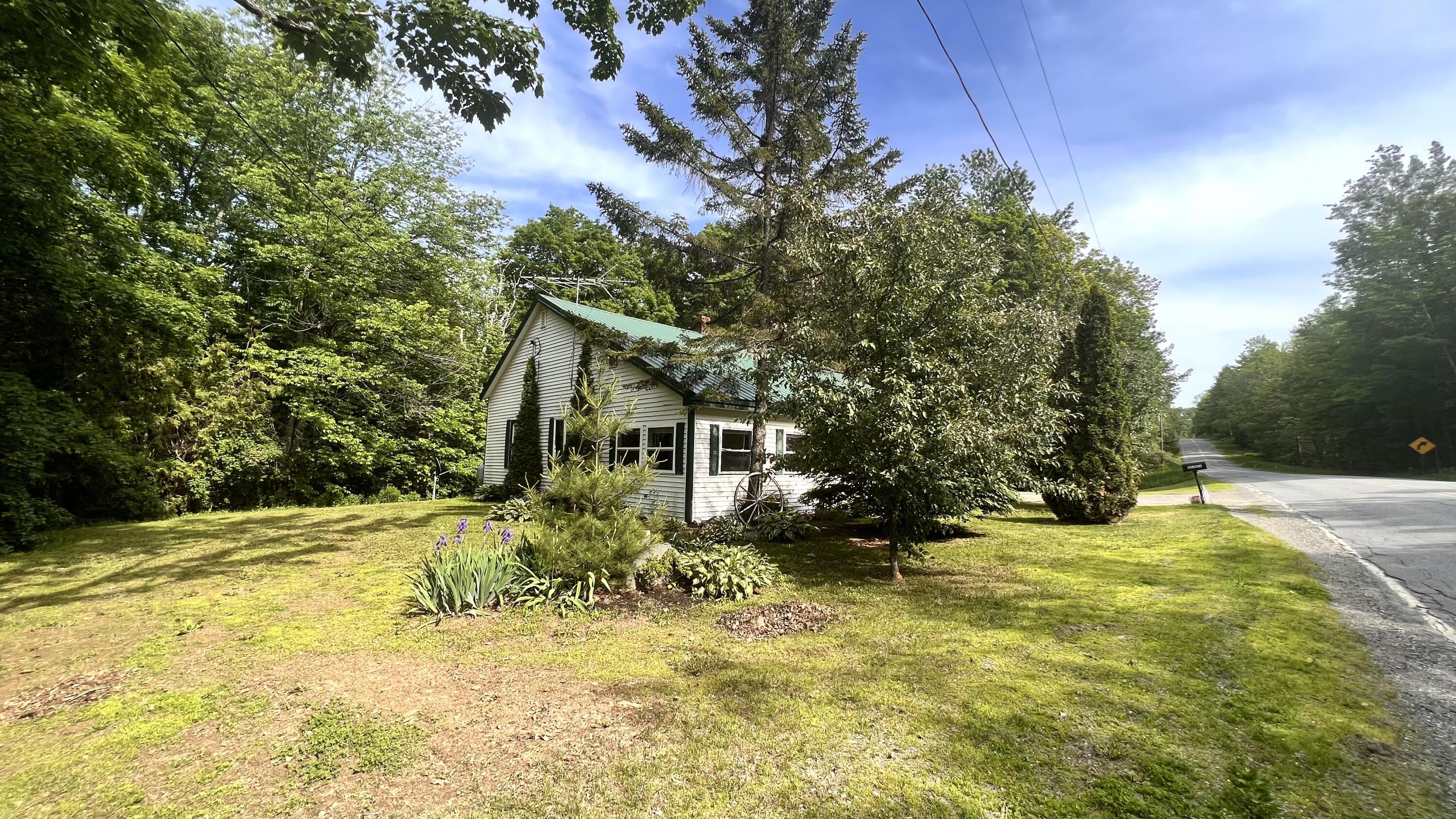 801 Stetson Road Exeter, ME 04435 - Photo 6 of 53 6. Side with lawn