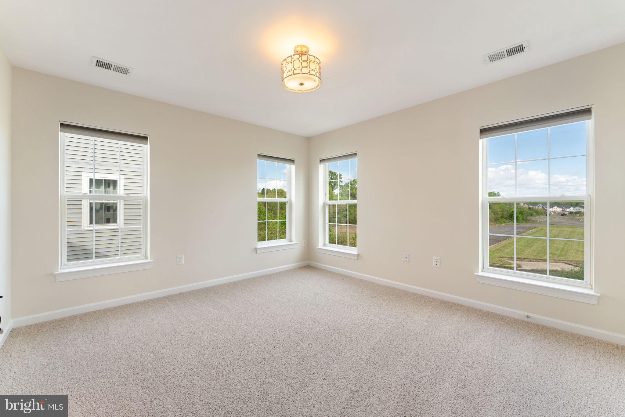 7418 Riding Meadow Way, Unit 25 Manassas, VA 20111 - Photo 14 of 36 Primary Bedroom