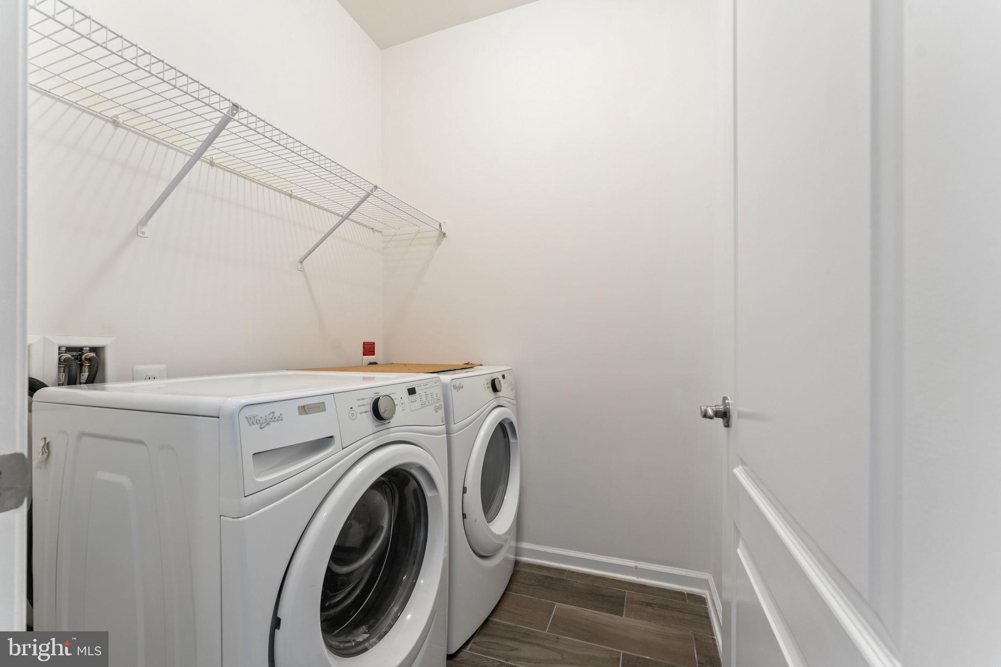 7418 Riding Meadow Way, Unit 25 Manassas, VA 20111 - Photo 27 of 36 Downstairs laundry room