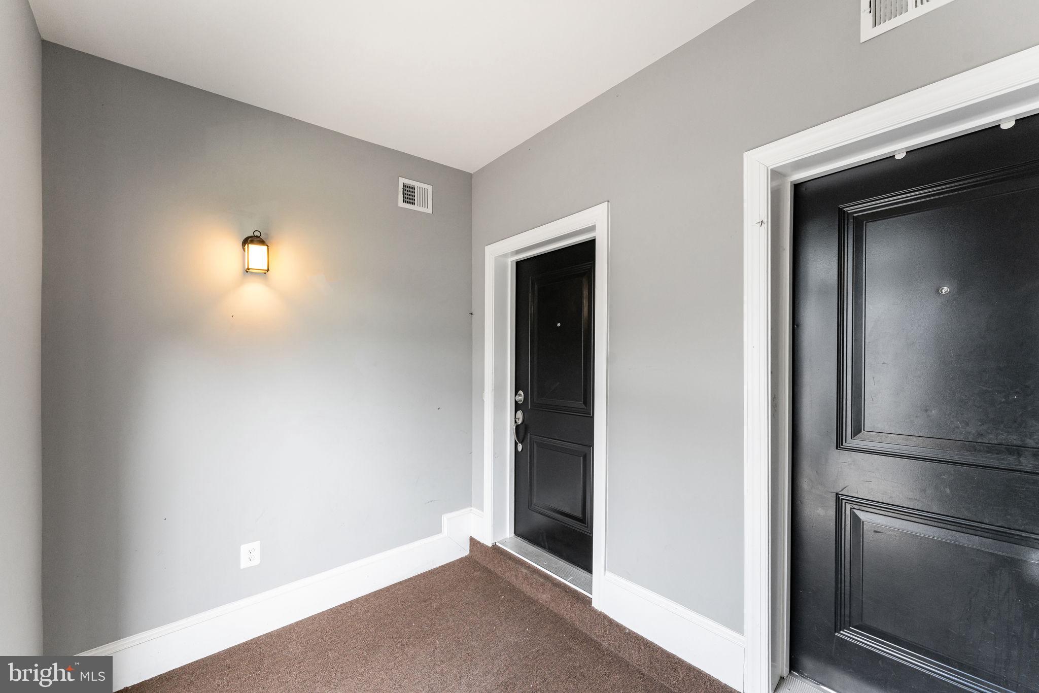 7418 Riding Meadow Way, Unit 25 Manassas, VA 20111 - Photo 3 of 36 Entry vestibule to front door of condo