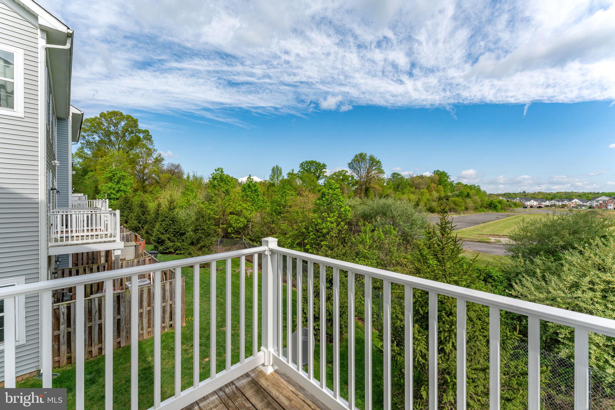 7418 Riding Meadow Way, Unit 25 Manassas, VA 20111 - Photo 31 of 36 Wood deck off of kitchen