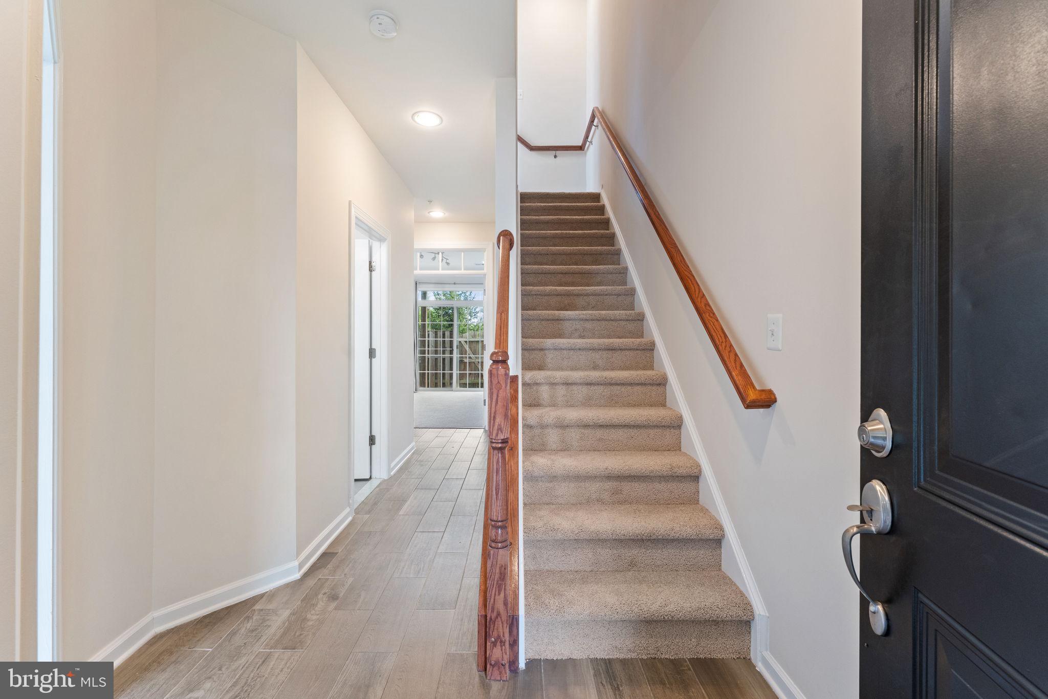7418 Riding Meadow Way, Unit 25 Manassas, VA 20111 - Photo 4 of 36 Entryway stairs going up to main level