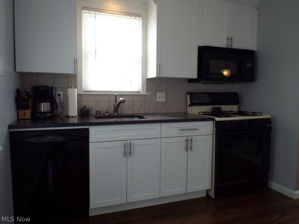 1264 Gordon Road Lyndhurst, OH 44124 - Photo 7 of 21 Light-filled kitchen offers plenty of storage space!