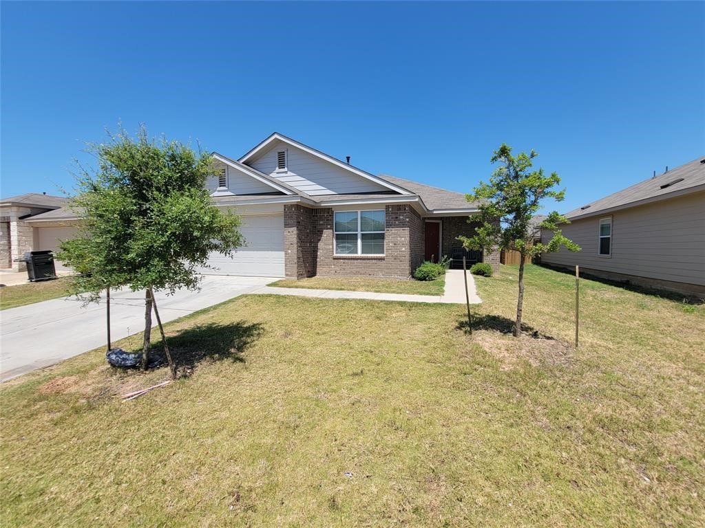 3610 Batson Drive Austin, TX 78725 - Photo 1 of 30 a house with a tree in the background