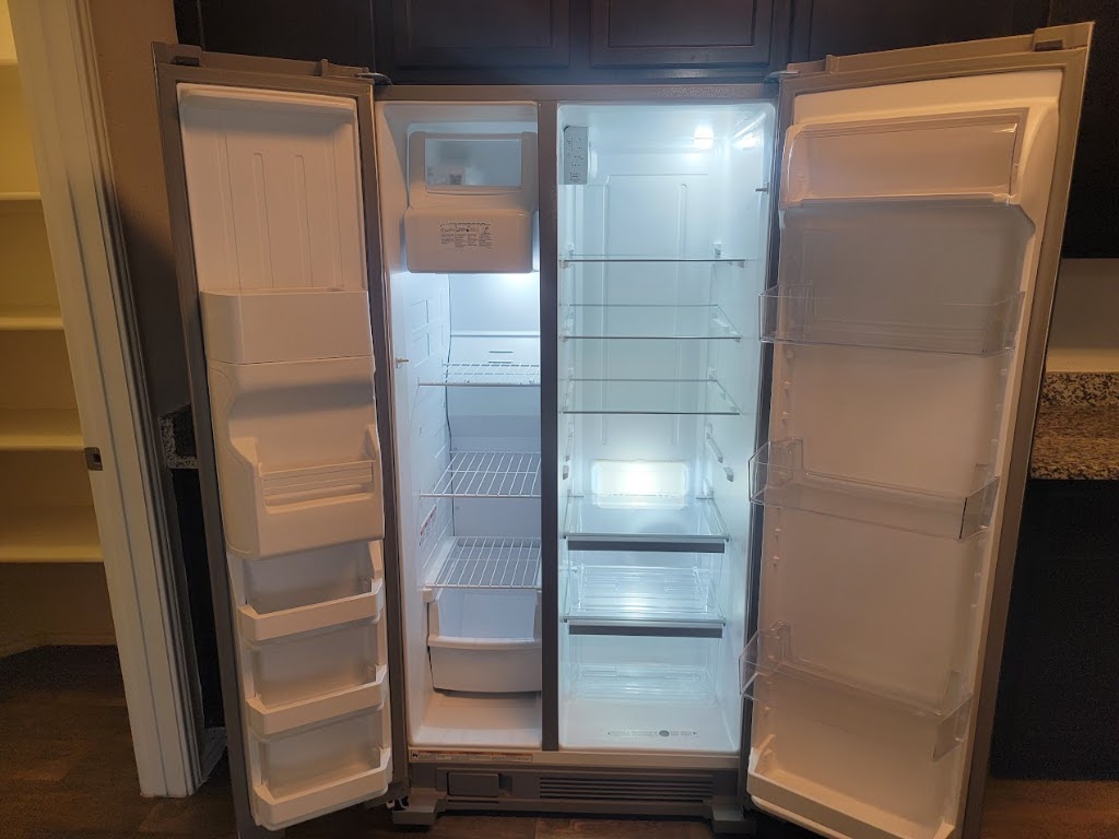 3610 Batson Drive Austin, TX 78725 - Photo 17 of 30 a bathroom with a glass shower door and mirror