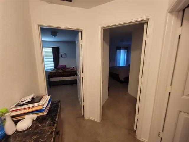 a view of a bedroom with bed and furniture