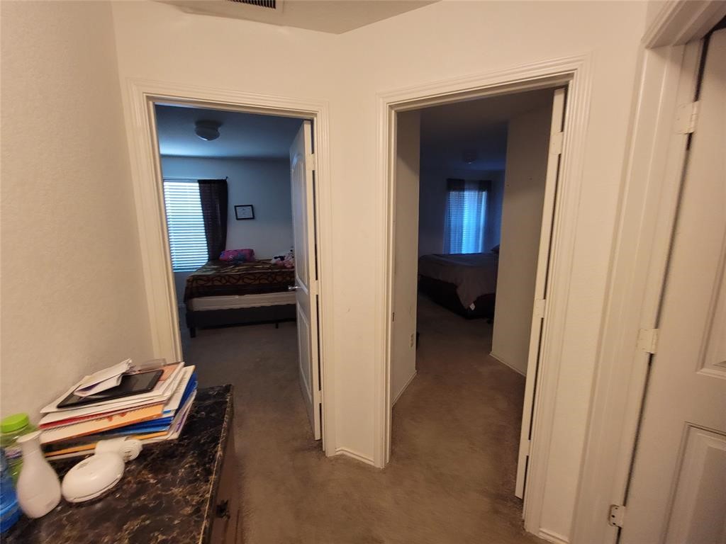3610 Batson Drive Austin, TX 78725 - Photo 19 of 30 a view of a bedroom with bed and furniture