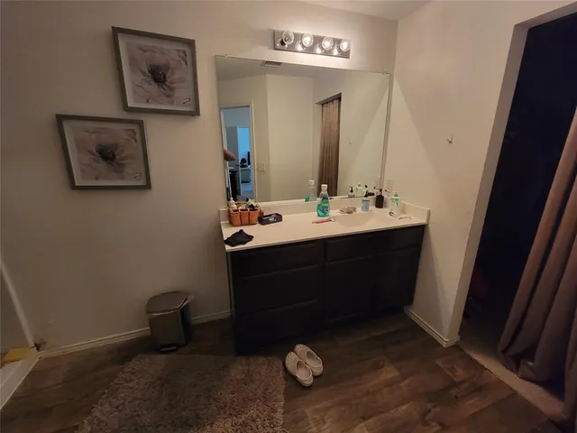 a room with a mirror and furniture