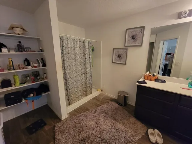 a bathroom with a sink toilet and vanity