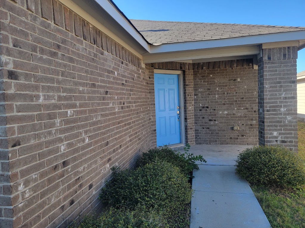 3610 Batson Drive Austin, TX 78725 - Photo 3 of 30 a brick house with a yard