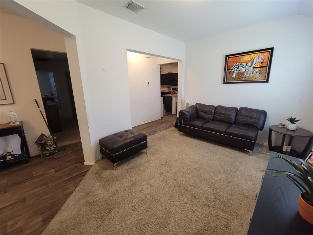 3610 Batson Drive Austin, TX 78725 - Photo 6 of 30 a living room with furniture and a mirror