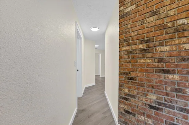 an empty room with large windows and view