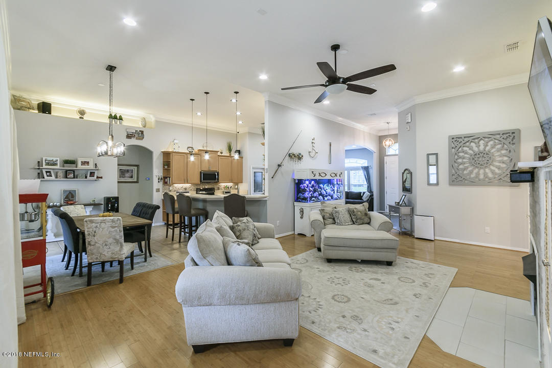 12171 Captiva Bluff Road Jacksonville, FL 32226 - Photo 35 of 36 a living room with furniture and kitchen view
